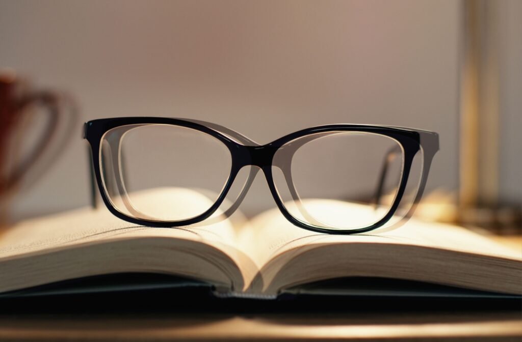 A picture of eyeglasses on a book demonstrating what double vision following a concussion can look like.