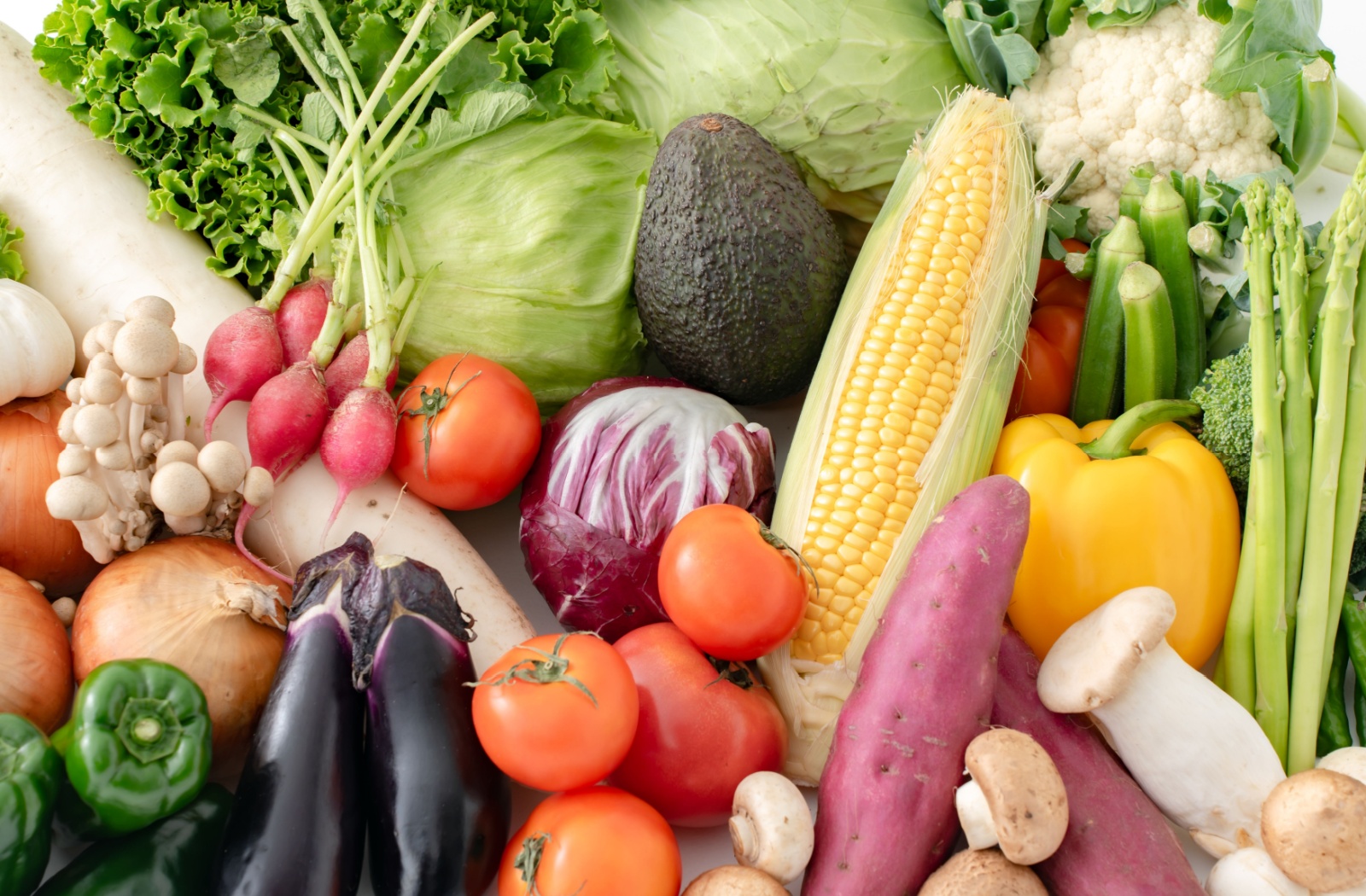 Group of different types of vegetables piled together.